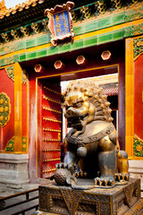 Golden Lion statue and historical architecture in Forbidden City in Beijing, China