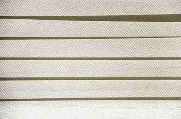 Fototapeta premium Vertical blind in horizontal background. Horizontal line pattern. White cloth curtain. Straight-line wallpaper. Shade and shadow on the white wall.