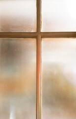 Wood cross and translucent glass. Jesus Christ crucifix shape. Representation of Christian cross using wood material.
