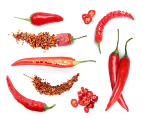 Wall murals Hot chili peppers Set with red hot chili peppers and flakes on white background