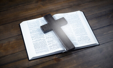 Bible open. Cross, crucifixion of Jesus. Love concept. On a wooden table.