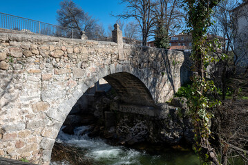 Fototapeta na wymiar Puente Viejo or Puente de la Cañada Real, an old medieval bridge recently restored.