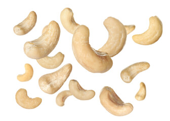 Tasty raw cashew nuts falling on white background