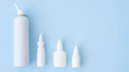 Different bottles with medicines on a blue background