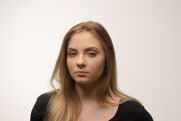 Fototapeta premium Angry young woman portrait in studio white background