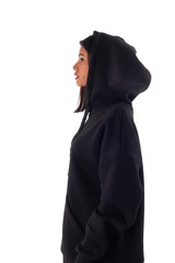 Attractive woman of Latin appearance wears a dark hoodie on a white isolated background. The girl...
