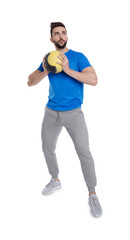 Athletic man doing exercise with medicine ball isolated on white