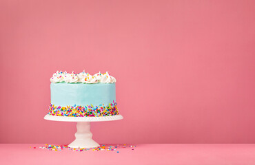 Blue Birthday Cake on Pink Background - 484988634