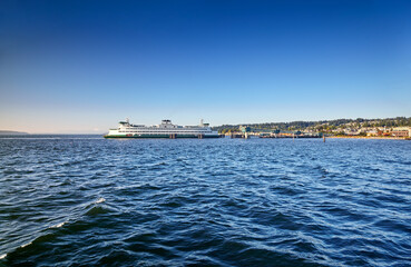 Washington State ferry arrives at the Edmonds dock late on a sunny Summer afternoon