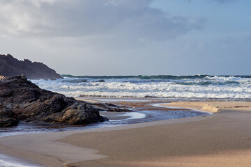 Fototapeta na wymiar Rostro beach in Finisterre, Galicia, Spain. This wild beach and one of the surfer's paradises in the region of Costa da Morte