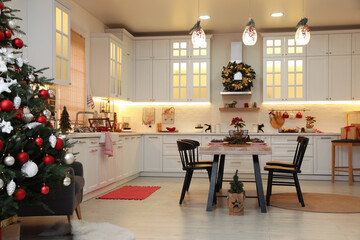Cozy dining room interior with Christmas tree and beautiful festive decor