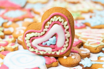 Heart shaped sugar cookies for St Valentines Day with colorful icing.