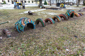 Outdoor playground and training area. Different car tires are painted in different colors.