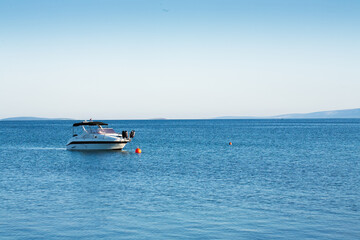 Small luxurious yacht moored at sea