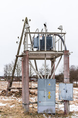 Electricity pole and transformer on a winter day.