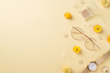 Top view photo of woman's day composition stylish glasses eyeshadows cosmetics golden wristwatch hearts and wild flowers on isolated beige background with copyspace
