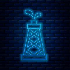 Glowing neon line Oil rig icon isolated on brick wall background. Gas tower. Industrial object. Vector