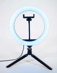 Ring lamp on a small tripod. Blue light.
