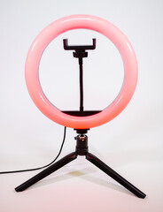 Ring lamp on a small tripod. Red light.