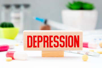 Motivational and inspirational word - Depression written on wooden blocks and arranged on a wooden table