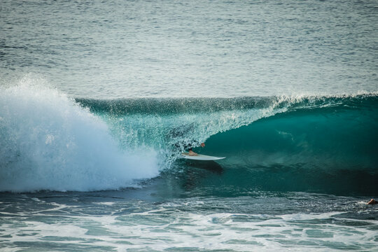 Surfer in a perfect barrel wave.