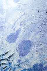 abstract creative grunge background: oil paint frozen on the palette after thinning, many cracks and peeling, short focus.