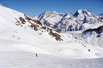Wide ski slopes of Courchevel ski resort in winter 