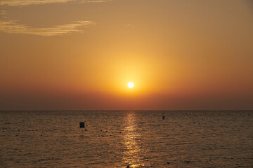 The sun rises over the Red Sea at dawn.