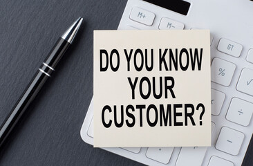 Text DO YOU KNOW YOUR CUSTOMER on sticker on the calculator, business concept
