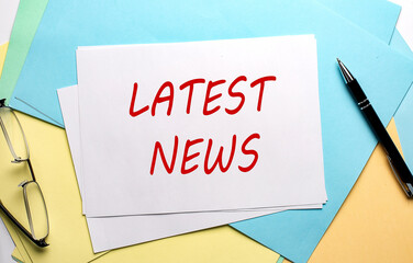 LATEST NEWS text on paper on the colorful paper background