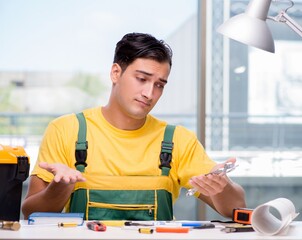 Construction worker sitting at the desk