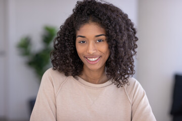 Young black woman smile happy face portrait at home