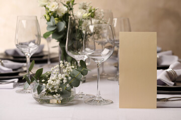 Stylish elegant table setting for festive dinner in restaurant