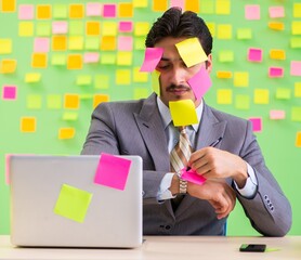 Businessman with many conflicting priorities