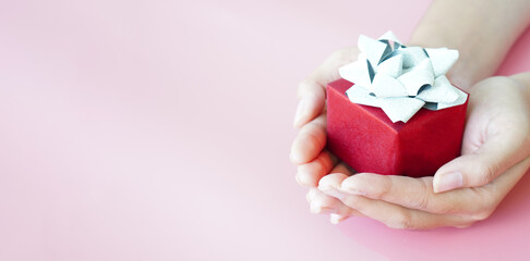 banner woman raising her hand to wrap a gift Christmas gifts for special occasions