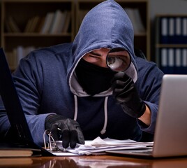 Hacker stealing personal data from home computer