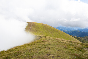 Beautiful mountain landscape with big white cloud. Ukraine Carpatian