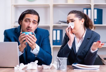 Two employees suffering at workplace