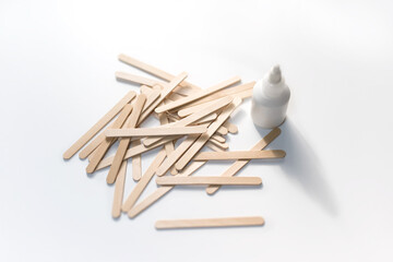Building material. Making things from wooden Popsicle sticks (also called as wooden craft sticks) - Powered by Adobe