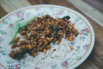 Rice topped with stir-fried pork or beef and basil