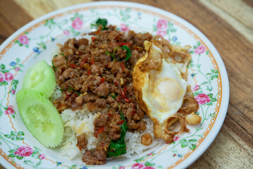 Rice topped with stir-fried pork or beef and basil