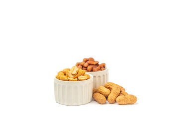 Three varieties of peanuts in bowls on the white background with space for text.