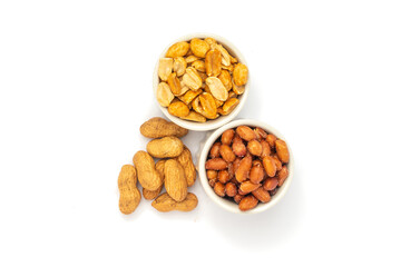 Three varieties of peanuts in bowls on the white background with space for text.