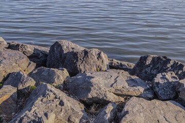 Rocky rocky seashore close-up. Rocky stones on the shore
