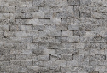 Wall of pieces of natural stone as a background