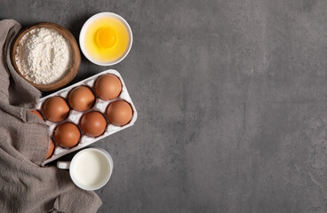 Ingredients for baking on stone material (milk, egg, flour)
