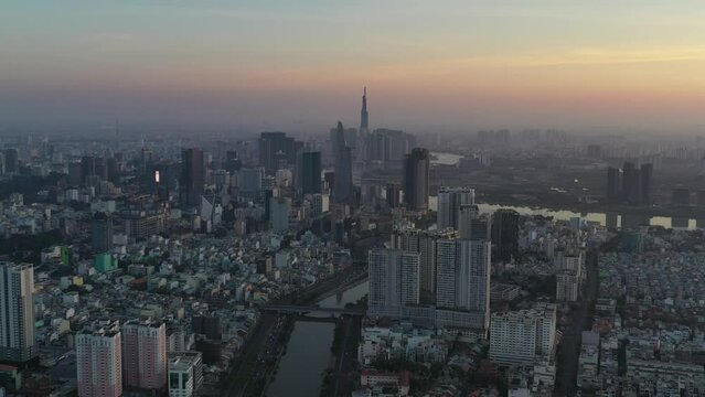 Ho Chi Minh City, Vietnam Feb 2022 4k aerial video of Downtown city skyline during Tet holiday at Sunrise