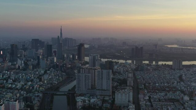 Ho Chi Minh City, Vietnam Feb 2022 4k aerial video of Downtown city skyline during Tet holiday at Sunrise