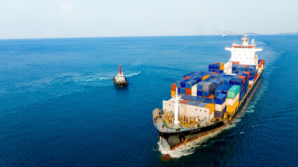 Container ship was dragged by tug boat to international cargo port for service transportation ...