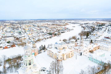 Fototapeta na wymiar Aerial drone view of Novotorzhsky Borisoglebsky Monastery with Tvertsa river in Torzhok, Russia. Russian winter landscape